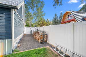 View of yard featuring a gate and a fenced backyard