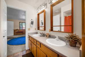 Bathroom featuring double vanity and a sink
