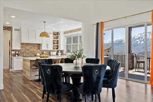Dining room with wood finished floors, recessed lighting, and a mountain view