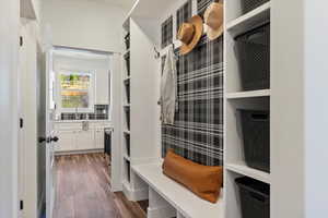 Mudroom with dark wood-style flooring