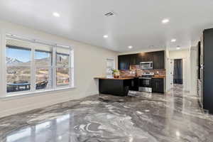 Kitchen featuring stainless steel appliances, baseboards, visible vents, recessed lighting, and decorative backsplash