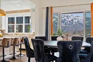Dining room featuring recessed lighting, wood finished floors, plenty of natural light, and a mountain view