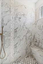 Bathroom featuring tiled shower