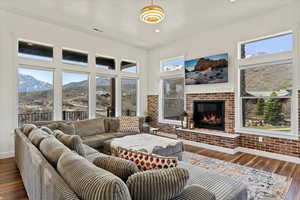 Living area with visible vents, a wealth of natural light, and dark wood-type flooring
