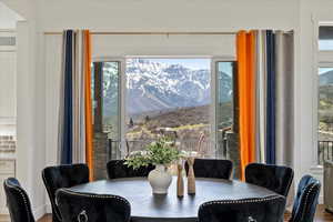 Dining area featuring a mountain view and a wealth of natural light