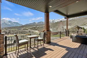 Wooden terrace featuring a mountain view