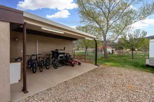 View of patio / terrace featuring fence and a grill