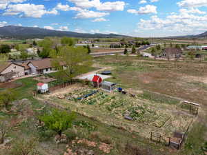 Birds eye view of property with a rural view and a mountain view