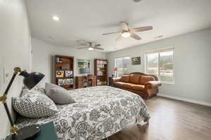 Bedroom with visible vents, baseboards, recessed lighting, a ceiling fan, and wood finished floors