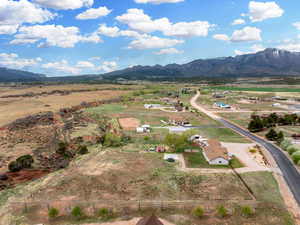 Birds eye view of property with a rural view and a mountain view