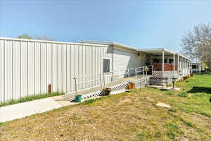 Exterior space featuring a lawn