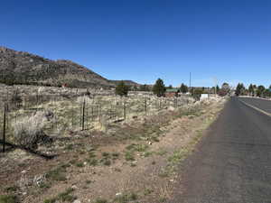 View of street with a rural view and a mountain view