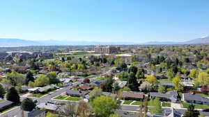 Birds eye view of property with a mountain view and a residential view