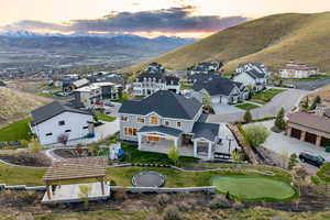 Aerial view at dusk featuring a residential view and a mountain view
