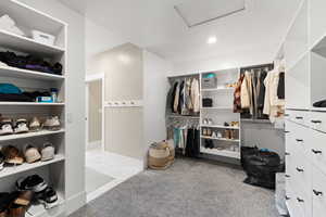 Walk in closet featuring attic access