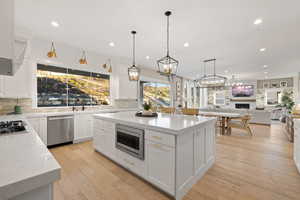 Kitchen with appliances with stainless steel finishes, tasteful backsplash, and recessed lighting