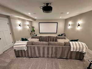 Home theater room featuring baseboards, carpet floors, and recessed lighting