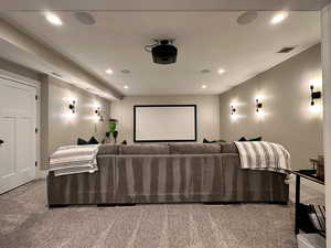 Home theater room featuring recessed lighting, visible vents, and carpet