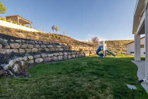View of yard with a playground