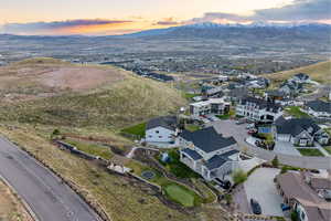 Aerial view at dusk featuring a mountain view and a residential view