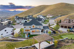 Birds eye view of property with a mountain view and a residential view