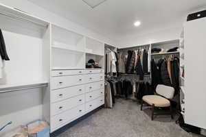 Spacious closet featuring carpet floors