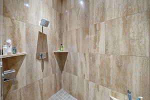 Bathroom with tiled shower