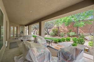 View of patio featuring grilling area and a fenced backyard