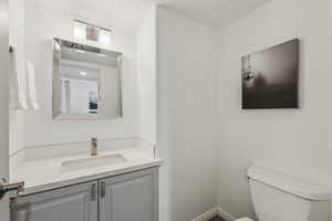 Bathroom featuring vanity and toilet