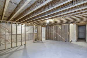View of unfinished basement.  Plumbed for a second full bathroom and framed for additional storage closets as well as a potential 4th bedroom with full size window and an additional media room.