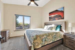 Bedroom with baseboards, carpet, and ceiling fan