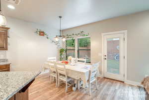 Dining room featuring recessed lighting, light wood finished floors, visible vents, baseboards, and a chandelier