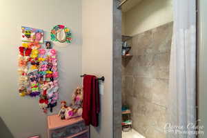 Full bathroom with a tile shower