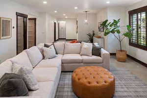 Living room with baseboards and recessed lighting
