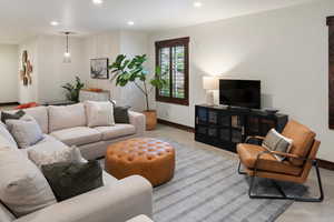 Living room featuring recessed lighting and baseboards
