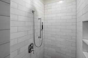 Full bathroom with tiled shower