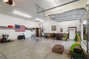 Garage with a garage door opener and electric panel