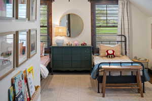 Bedroom featuring vaulted ceiling