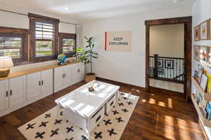 Interior space featuring baseboards, dark wood-style floors, and recessed lighting