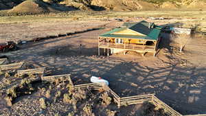 Rear view of house featuring a view of countryside and metal roof