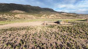 View of mountain backdrop featuring rural landscape
