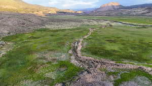 View of mountain backdrop with rural landscape