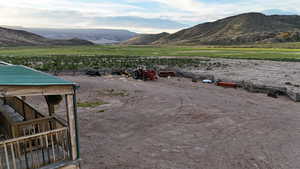 View of mountain backdrop with rural landscape