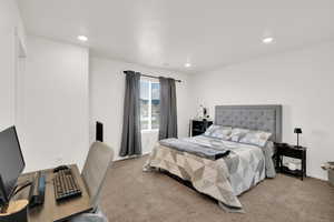 Bedroom featuring recessed lighting, carpet floors, and baseboards