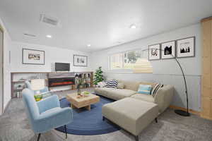 Lower level family room with electric fireplace, new carpet and fresh neutral paint.  Virtually Staged