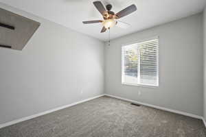 One of three bedrooms on the main floor with fresh neutral paint and brand new carpet.
