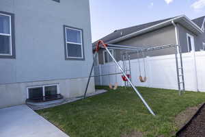 View of yard featuring fence