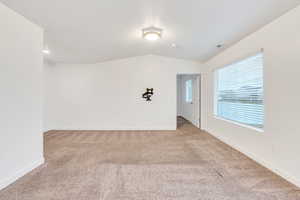 Family room with vaulted ceilings and oversized windows!