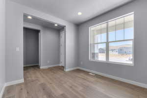 Unfurnished bedroom featuring baseboards, visible vents, recessed lighting, and light wood-style floors