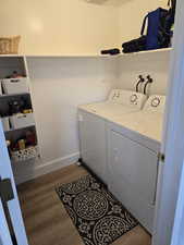 Utility room for full size washer and dryer and storage/pantry area